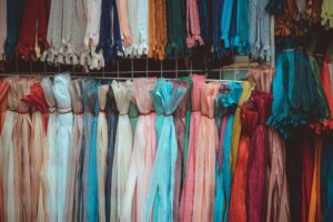 A vibrant array of textile samples showcases diverse fabric textures and colors.